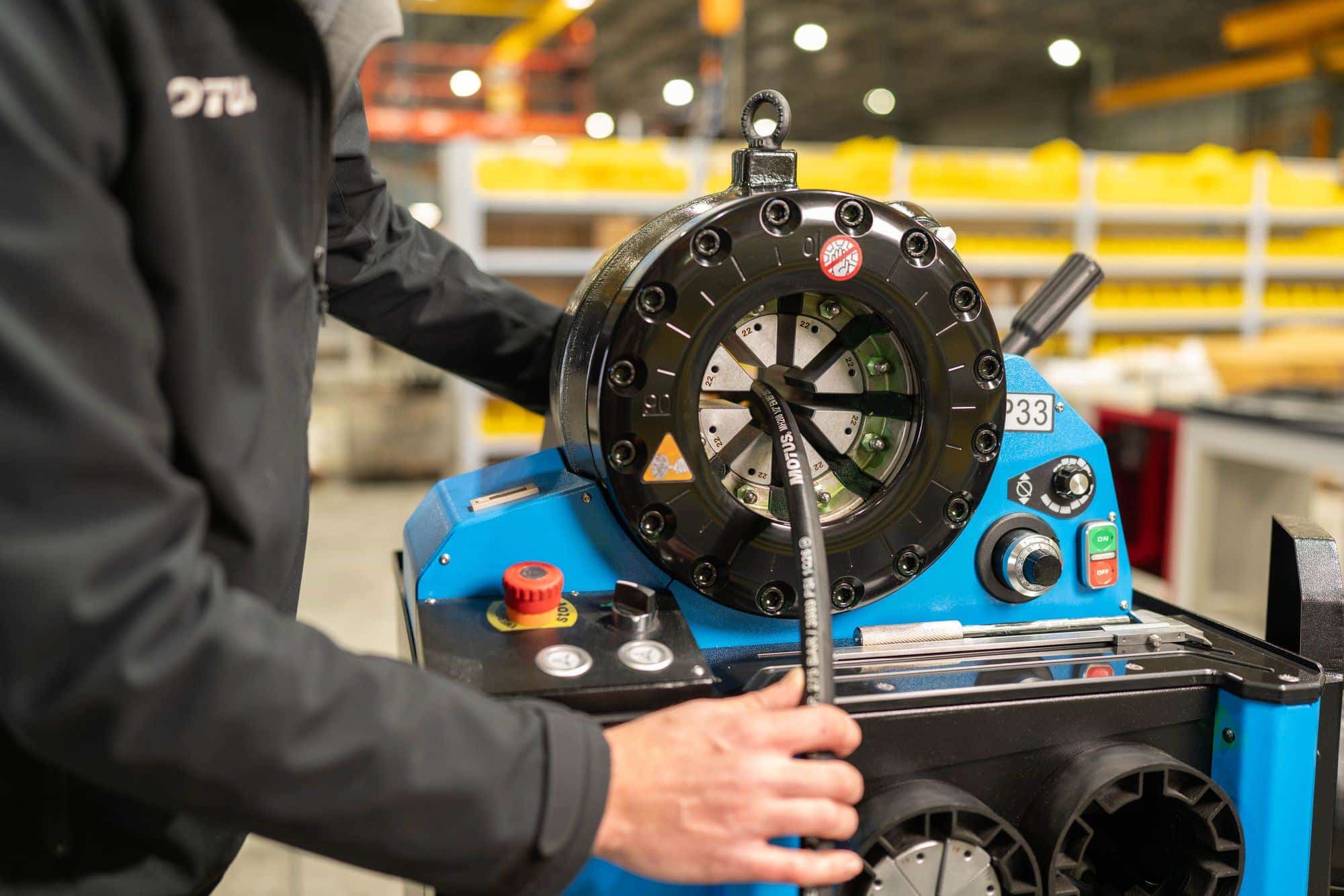 A hydraulic hose being crimped
